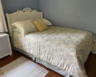 Off-white full-size headboard. Pale yellow comforter and bedskirt. Mattress and boxspring. All items sold together or separately.