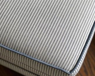 Tufted back chair and ottoman upholstered in blue ticking. Ottoman has contrasting navy blue piping. Chair measures 27" W x 31" D; ottoman is 27" x 20". Photo 2 of 2.