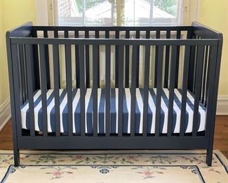Land of Nod crib painted in Hale Navy and new mattress.