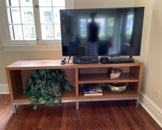 Media/storage shelf with metal base.