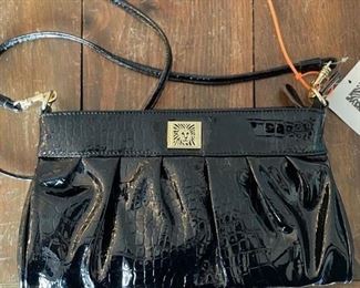 Anne Kline black patten leather purse.
