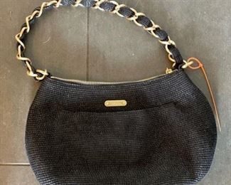 Eric Javits woven black purse with gold braided handle.