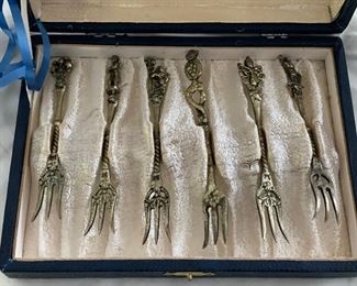 Vintage brass canapé fork set.