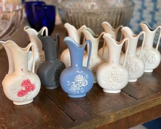 Collection of unglazed porcelain pitchers signed by artist.