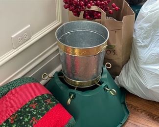 Christmas decorations including tree skirt, stand, faux berry decor, pine cones and artificial wreaths.