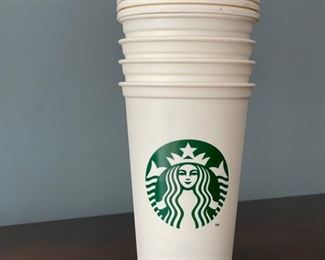 Four Grande reusable Starbucks cups.