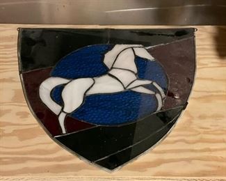 Stained glass unicorn crest.