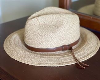 Straw cowboy hat with leather trim.