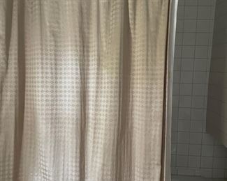 Shower curtain with shell hooks.