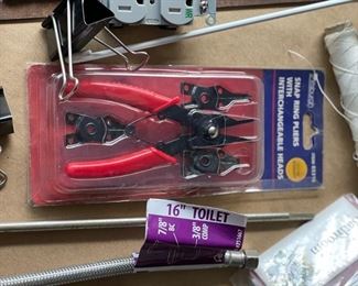 Snap ring pliers with interchangeable heads.