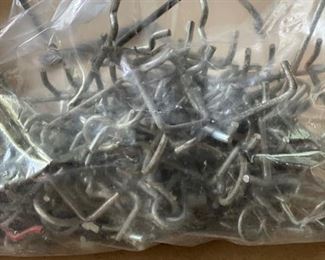 Metal pegs for pegboard.