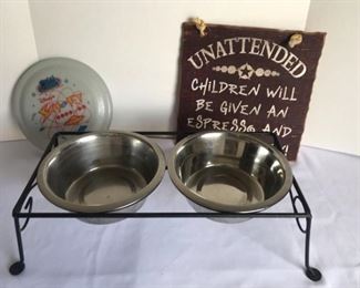 Dog Bowls, Frisbee, and Funny Sign