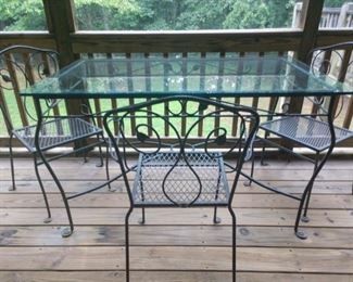 Vintage glass top wrought iron table with 4 chairs