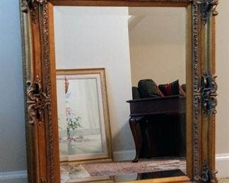 Antique ornate wood frame beveled mirror