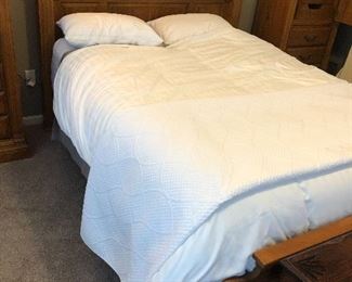 Solid oak bed with matching dresser and tall side cabinets