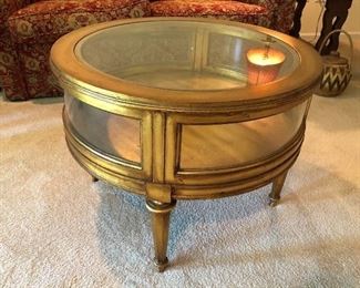 Round gold coffee/display table 