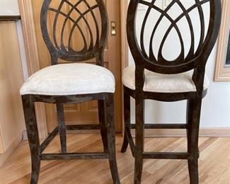 Set of 3 bar stools upholstered in cream damask fabric. Each measures 50" H x 21" W; seat height 21".