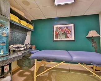 Vintage green Gurami desk unit with live edge formica styling. Shown with EarthLight massage table. 