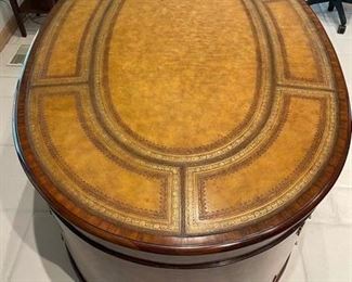 20th century regency Maitland Smith Bombay partner desk in leather with gold embossing throughout. 18 drawers in total. Ornate brass hardware. Measures 45" W x 30" H x 70"L. Photo 2 of 3. 
