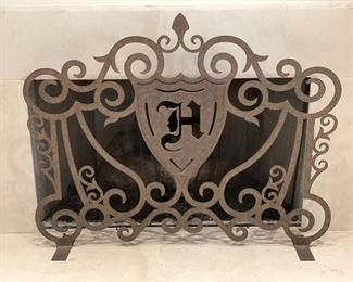 Monogrammed "H" fireplace screen. 