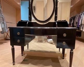 Hurtado Furniture ebonized wood vanity with oval mirror. Measures 18" D x 44" W x 64" H. 