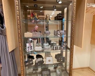 Gilt display cabinet with interior lighting, mirrored back and four glass shelves. Photo 1 of 2. 