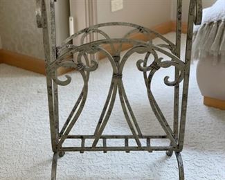 Metal magazine rack side table with glass top. Measures 24" H x 16" D x 16" W.