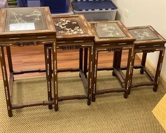 Set of 4 antique teak glass-topped stacking tables with bovine inlay. Largest measures 20" W x 15" D x 26" H; smallest measures 10" W x 12" D x 19" H. Photo 1 of 4. 