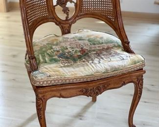 Antique French carved wood game table with parquet top and hidden bid drawers purchased from E. G. Cody. Four cane-back chairs upholstered in Scalamandre toile fabric available, too..  Photo 4 of 5.