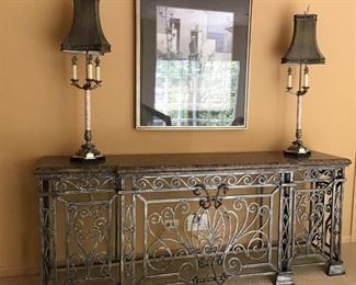 Britt Carter stone and metal scroll console. 