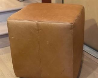 Leather cube ottoman. 