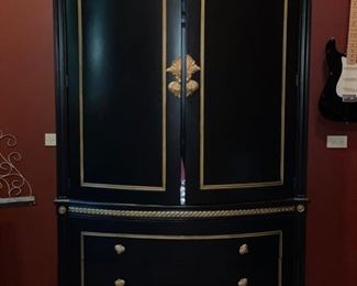 Maitland Smith ebony and gold entertainment center purchased at Judith Norman DCOTA. Measures 54" W x 31"D x  86" H. 