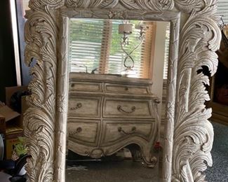 Cast stone mirror.