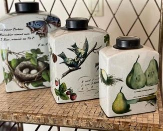 Set of three decorative canisters. 