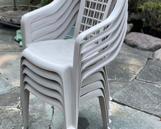 Set of 24 plastic outdoor stacking chairs. 