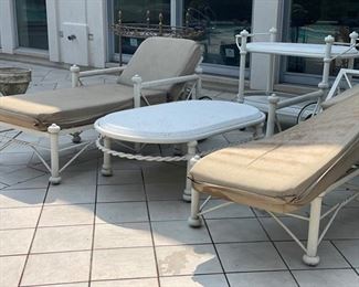 Outdoor chaise loungers, bar cart and side table. 
