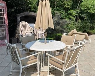Outdoor dining room set with umbrella. 
