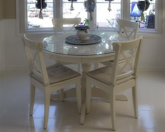 breakfast room, white dining furniture with a glass top protecting the finish