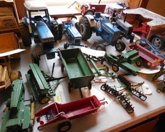 Vintage toy tractors and farm implements