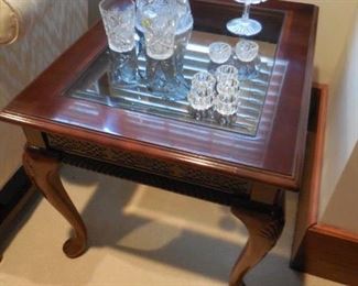 End table with old glassware