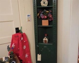 Small, dark green corner cabinet