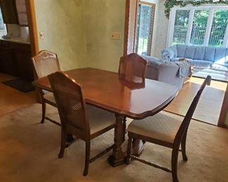 Dining room table w/4 matching cane back chairs 29" H X 61" X 40" W