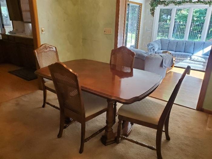Dining room table w/4 matching cane back chairs 29" H X 61" X 40" W