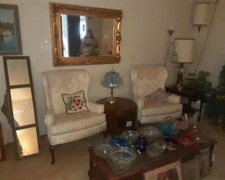 Wingback chairs, large mirror (sold), crystal bowls, lamps
