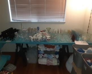 Black glass set, cups, mugs, glasses, stemware, glass punch bowl and lots of towels