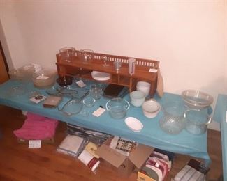 Pyrex, mixing bowls, bakeware, set of hot pink towels and bath rug, pot holders and dish towels