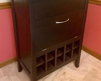 30.5w x 19.5d x 37h Bar Cabinet $125
Top slides open
Center opens to work counter w/ 
Wine glass holders above
Bottom cubbies for 20 bottles 