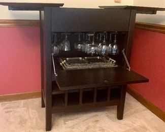 30.5w x 19.5d x 37h Bar Cabinet $125
Top slides open
Center opens to work counter w/ 
Wine glass holders above
Bottom cubbies for 20 bottles 
