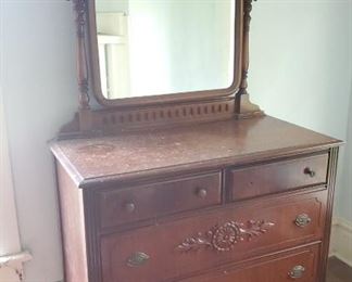 2 over 2 dresser with mirror and casters, beautiful detail 