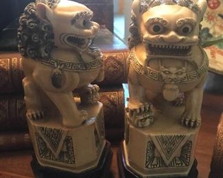 Pair of antique carved foo dogs